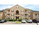 Attractive condo building with balconies, parking, and well maintained landscaping at 14316 Fredricksburg Dr # 507, Orlando, FL 32837