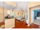 Open-concept living area with wood floors and adjacent kitchen and office space at 14316 Fredricksburg Dr # 507, Orlando, FL 32837
