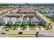 An aerial view shows the property's location within a well-planned community, surrounded by greenery and amenities at 1551 Flange Dr, Davenport, FL 33896