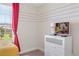 bedroom featuring an entertainment center with TV, window and cartoon themed wall at 1551 Flange Dr, Davenport, FL 33896