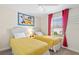 Cozy bedroom with twin beds, red curtains, ceiling fan and cartoon themed wall art at 1551 Flange Dr, Davenport, FL 33896