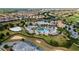 Resort-style community pool area with lush landscaping, palm trees, and plenty of space for relaxation and recreation at 1551 Flange Dr, Davenport, FL 33896