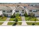 Charming home showcasing a beautifully landscaped front yard with lush greenery and a welcoming entrance at 1551 Flange Dr, Davenport, FL 33896