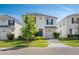 Charming two-story home featuring a well-manicured lawn and a bright blue front door and shutters at 1551 Flange Dr, Davenport, FL 33896