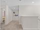 Upstairs hallway with carpet flooring leading to bedrooms for privacy and comfort at 1551 Flange Dr, Davenport, FL 33896