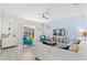 Bright living room with stylish furniture, a ceiling fan, and sliding glass doors to the patio at 1551 Flange Dr, Davenport, FL 33896