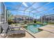 Inviting backyard pool area with lounge chairs, perfect for relaxing and enjoying the outdoors at 1551 Flange Dr, Davenport, FL 33896