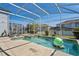Relaxing screened-in pool with clear blue water, perfect for enjoying sunny days and outdoor recreation at 1551 Flange Dr, Davenport, FL 33896