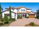 Beautiful Mediterranean-style home showcasing a brick driveway and meticulous landscaping at 15681 Panther Lake Dr, Winter Garden, FL 34787