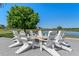 Outdoor firepit area with Adirondack chairs, perfect for gathering with friends and Gathering near the pond at 15681 Panther Lake Dr, Winter Garden, FL 34787