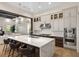 Modern kitchen boasts a large island with seating, stainless steel appliances, and custom cabinetry at 15681 Panther Lake Dr, Winter Garden, FL 34787