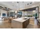 Gourmet kitchen with a large central island, stainless appliances, and an open layout at 15681 Panther Lake Dr, Winter Garden, FL 34787