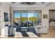 Bright and airy living room with large windows, a fireplace, and stylish furniture at 15681 Panther Lake Dr, Winter Garden, FL 34787