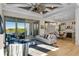Open concept living area flowing seamlessly into dining area and outdoor space with water view at 15681 Panther Lake Dr, Winter Garden, FL 34787