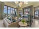 Clubhouse lobby with comfortable seating, large windows, and stylish decor with access to a lake view at 15681 Panther Lake Dr, Winter Garden, FL 34787