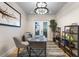 This home office features French doors, modern lighting, and built-in shelving, offering an inviting workspace at 15681 Panther Lake Dr, Winter Garden, FL 34787