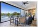 Relaxing outdoor patio featuring a seating area with a pool and lake view at 15681 Panther Lake Dr, Winter Garden, FL 34787