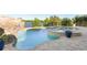 Resort-style pool area boasts a rock waterfall, spa, and picturesque landscaping at 15681 Panther Lake Dr, Winter Garden, FL 34787