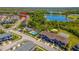 Aerial view of the property highlighting the community pool, clubhouse, and surrounding landscape at 16241 Old Ash Loop, Orlando, FL 32828