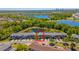 Aerial view of the townhome, beautiful lakes, and lush green trees surround it at 16241 Old Ash Loop, Orlando, FL 32828