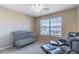 Bedroom with a crib and recliner chair offering comfort and style at 16241 Old Ash Loop, Orlando, FL 32828