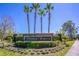 Timber Pointe community entrance sign with palm trees and lush landscaping at 16241 Old Ash Loop, Orlando, FL 32828