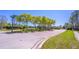 Gated entrance to Timber Pointe community with lush landscaping, well manicured lawns and sidewalks at 16241 Old Ash Loop, Orlando, FL 32828