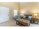 Cozy living room featuring a comfortable couch, coffee table, side tables, and natural light at 16241 Old Ash Loop, Orlando, FL 32828
