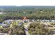 An aerial view of a well-maintained, modern single-Gathering home in a wooded lot on a cul-de-sac at 17236 Sw 44Th Cir, Ocala, FL 34473