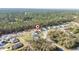 Overhead image of a single Gathering house near lots of trees, houses and vacant lots at 17236 Sw 44Th Cir, Ocala, FL 34473
