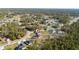 Wide aerial view of single Gathering home surrounded by lots of green trees in a residential area at 17236 Sw 44Th Cir, Ocala, FL 34473