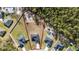 An overhead view showcases a modern home with a well-manicured lawn on a lot outlined in red at 17236 Sw 44Th Cir, Ocala, FL 34473