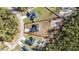 An aerial view showcases a modern home with a well-manicured lawn on a lot outlined in red at 17236 Sw 44Th Cir, Ocala, FL 34473
