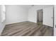 Well-lit bedroom with wood-look floors at 17236 Sw 44Th Cir, Ocala, FL 34473