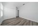Bright bedroom featuring wood-look floors and large closet at 17236 Sw 44Th Cir, Ocala, FL 34473