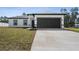 Charming one-story home featuring a two-car garage, well-maintained lawn, and neutral color palette at 17236 Sw 44Th Cir, Ocala, FL 34473