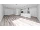 A spacious, open kitchen has a central island, recessed lighting, stainless appliances, and light wood flooring at 17236 Sw 44Th Cir, Ocala, FL 34473