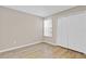 Comfortable bedroom features wood-look floors, a large closet and a window at 2007 Royal Bay Blvd # 144, Kissimmee, FL 34746