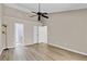 Spacious bedroom featuring wood-look floors and a ceiling fan for added comfort and climate control at 2007 Royal Bay Blvd # 144, Kissimmee, FL 34746