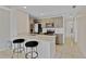 Kitchen featuring tile floors, granite countertops, subway tile backsplash, and black appliances at 2007 Royal Bay Blvd # 144, Kissimmee, FL 34746