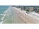 Beachside condominium with palm trees, oceanfront location, and resort-style pool near the beach at 2401 S Atlantic Ave # D306, New Smyrna Beach, FL 32169