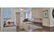 Bright kitchen boasts ample white cabinetry, granite counters, and convenient access to appliances and storage at 2401 S Atlantic Ave # D306, New Smyrna Beach, FL 32169