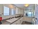 Well-equipped kitchen with ocean view, perfect for cooking while enjoying scenic views at 2401 S Atlantic Ave # D306, New Smyrna Beach, FL 32169