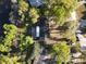 Aerial view showcases the home's roof, driveway, and mature trees surrounding the property at 278 Silverstone Dr, Orange City, FL 32763