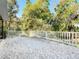 Backyard featuring a fence, lush greenery, and mature trees at 278 Silverstone Dr, Orange City, FL 32763