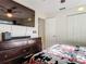 Bedroom with a dark wood dresser, ceiling fan, and large closet at 278 Silverstone Dr, Orange City, FL 32763