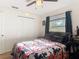 Bedroom with a large window, ceiling fan, and closet at 278 Silverstone Dr, Orange City, FL 32763