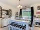 Charming dining area with a rustic table setting, natural light, and views of the outdoor landscape at 278 Silverstone Dr, Orange City, FL 32763
