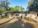 Charming single-story home featuring an attached garage, well-kept lawn and mature shade trees in a quiet location at 278 Silverstone Dr, Orange City, FL 32763