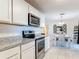 Modern kitchen with stainless steel appliances, granite countertops, and bright breakfast nook at 278 Silverstone Dr, Orange City, FL 32763